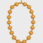 Colar SOLEA dourado com elementos em forma de sol, imagem integral com fecho e extensor para cima, fundo cinzento #EBEBEB